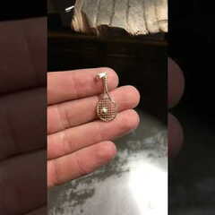 Кулон у вигляді тенісної ракетки зроблений у майстерні GRAMM OSCAR JEWELRY.